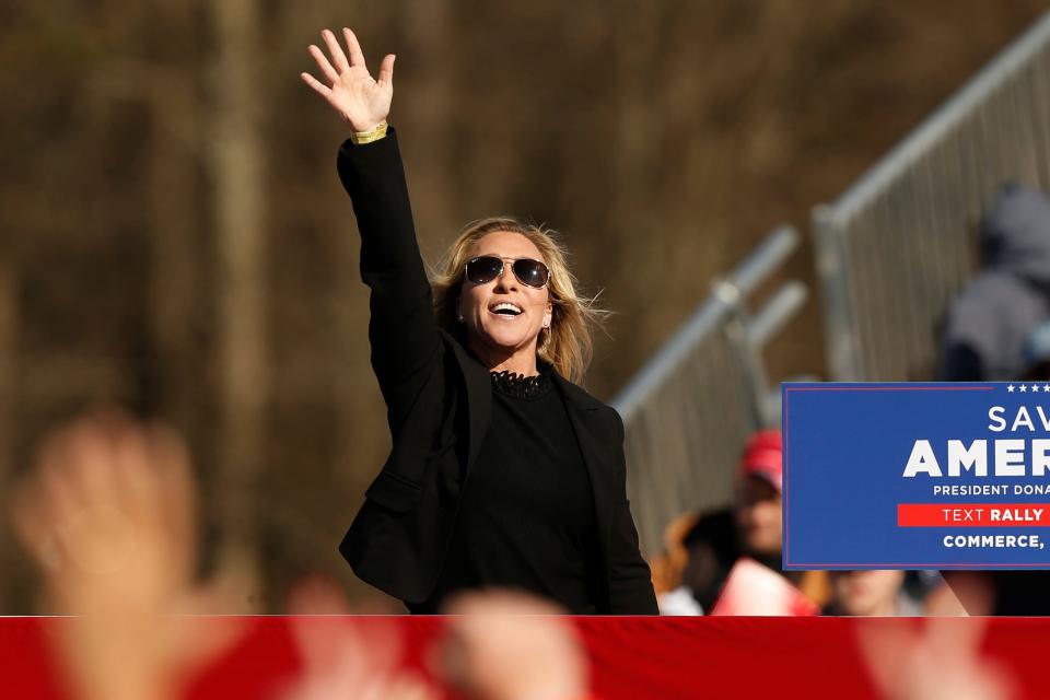 Georgia Rep. Marjorie Taylor Greene takes the stage at a "Save America Rally" at the Banks County Dragway on Saturday, March 26, 2022.