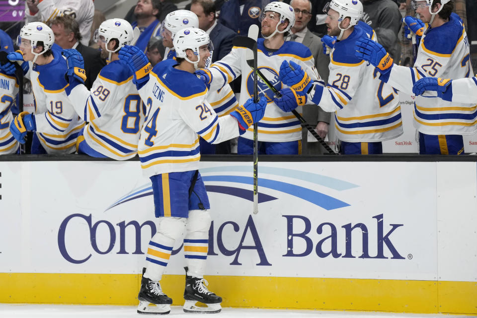 Buffalo Sabres center Dylan Cozens, foreground, is congratulated by teammates after scoring against the San Jose Sharks during the first period of an NHL hockey game in San Jose, Calif., Saturday, Feb. 18, 2023. (AP Photo/Jeff Chiu)
