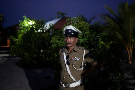 A police officer stands inside a training camp allegedly linked to Islamist militants, in Kattankudy near Batticaloa, Sri Lanka, May 5, 2019. REUTERS/Danish Siddiqui