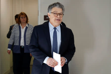 FILE PHOTO: U.S. Senator Al Franken walks out to speak to the media outside his office on Capitol Hill in Washington, U.S., November 27, 2017. REUTERS/Yuri Gripas