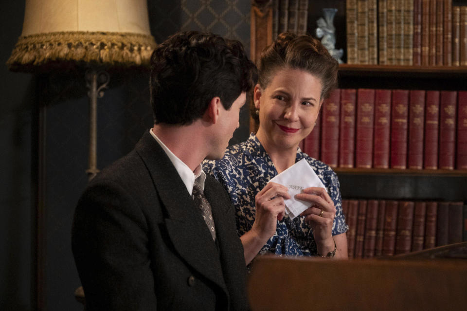 This image released by Hulu shows Logan Lerman, left, and Robin Weigert in a scene from "We Were the Lucky Ones." (Vlad Cioplea/Hulu via AP)