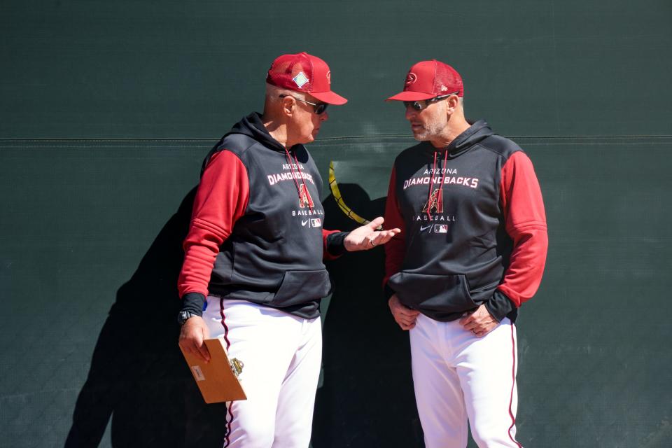 Diamondbacks manager Torey Lovullo (right), talks with pitching coach Brent Strom (left), at Salt River Fields at Talking Stick on March 11, 2022, in Scottsdale, Ariz.