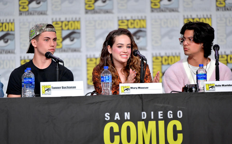 SAN DIEGO, CALIFORNIA - JULY 18: Tanner Buchanan, Mary Mouser, and Xolo Mariduena speak at the &quot;Cobra Kai: Past, Present, And Future&quot; panel during 2019 Comic-Con International at San Diego Convention Center on July 18, 2019 in San Diego, California. (Photo by Amy Sussman/Getty Images)