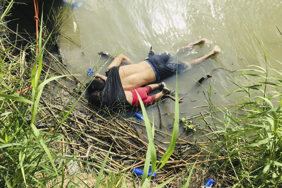 EDS NOTE: GRAPHIC CONTENT - The bodies of Salvadoran migrant Oscar Alberto MartÃnez RamÃrez and his nearly 2-year-old daughter Valeria lie on the bank of the Rio Grande in Matamoros, Mexico, Monday, June 24, 2019, after they drowned trying to cross the river to Brownsville, Texas. Martinez' wife, Tania told Mexican authorities she watched her husband and child disappear in the strong current. (AP Photo/Julia Le Duc)