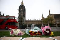 Floral tributes to killed British MP Amess outside parliament in London