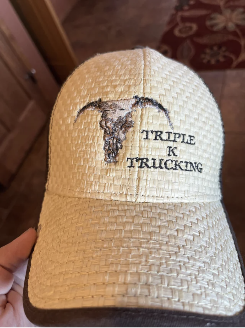The hat reads "triple K trucking"