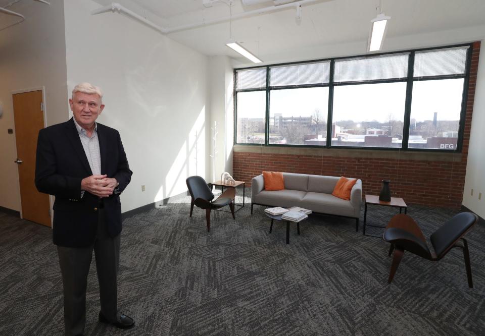 David Schipper, president and CEO of The Schipper Group, gives a tour of HQ, an office space company in the AES building in Akron.