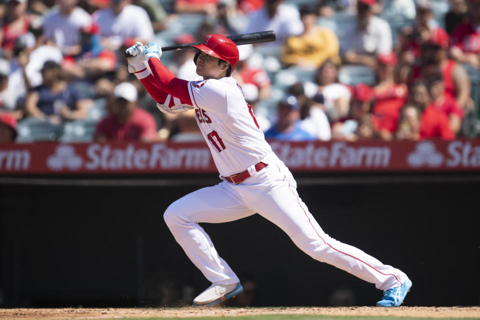 Los Angeles Angels' Shohei Ohtani watches his two-run home run during the fifth inning of a baseball game against the Detroit Tigers in Anaheim, Calif., Sunday, June 20, 2021. (AP Photo/Kyusung Gong)