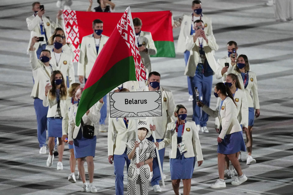 Athletes from Belarus walk during the opening ceremony in the Olympic Stadium at the 2020 Summer Olympics, Friday, July 23, 2021, in Tokyo, Japan. (AP Photo/David J. Phillip)