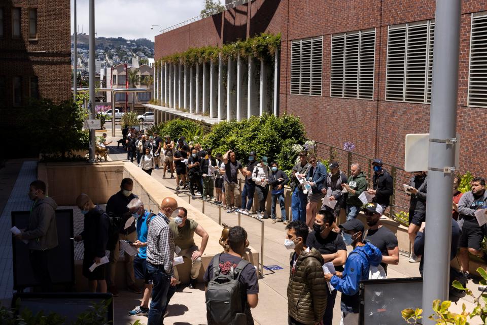 People stand in long lines to receive the monkeypox vaccine at San Francisco General Hospital in San Francisco, Tuesday, July 12, 2022.