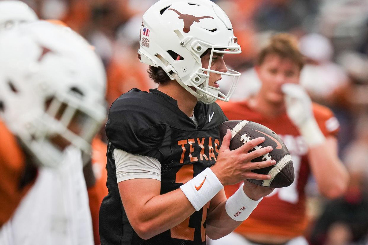 Texas quarterback Arch Manning looks to pass while warming up before Saturday's spring game. He'll enter the season as Quinn Ewers' top backup.