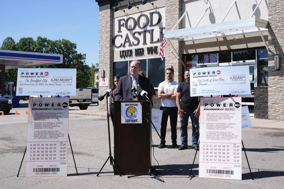 Attorney Mark K. Harder, representative of The Breakfast Club, reads a statement for the winners of the $842.4 million Powerball jackpot, from the Jan. 1, 2024 drawing, at a news conference at Food Castle in Grand Blanc Township, Mich., Tuesday, June 11, 2024. (AP Photo/Paul Sancya)