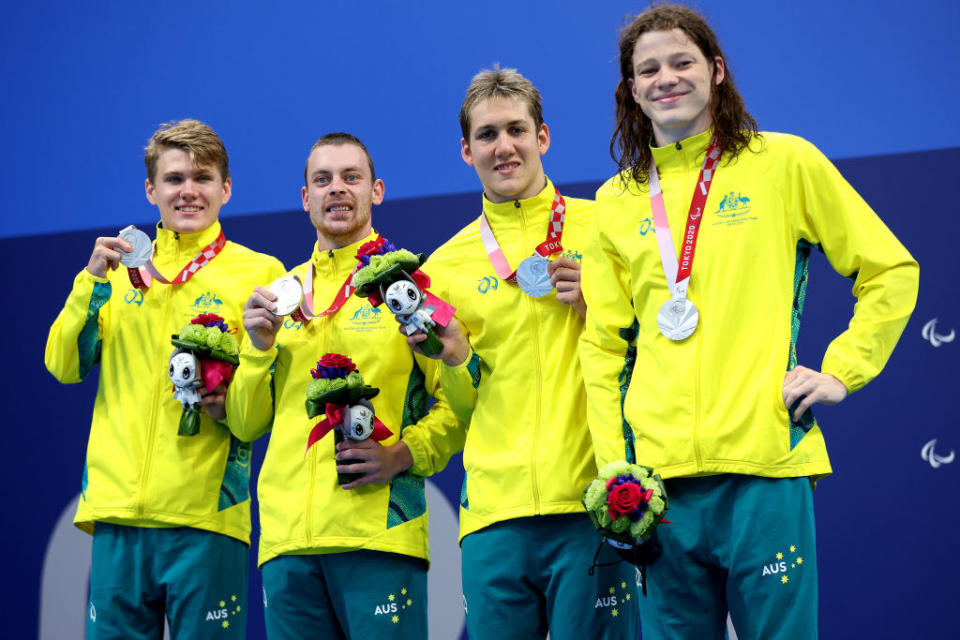 Silver medalist Timothy Hodge, Timothy Disken, William Martin and Ben Popham of Team Australia celebrate during the medal ceremony for the Men's 4x100m Medley Relay