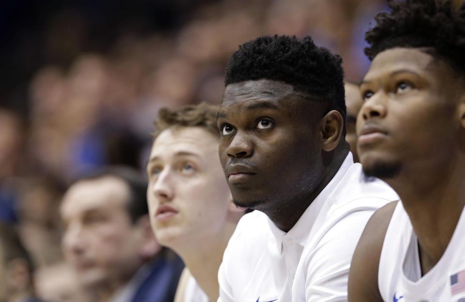 Duke's Zion Williamson, second from right, watches from the bench during the first half of the team's NCAA college basketball game against Wake Forest in Durham, N.C., Tuesday, March 5, 2019. (AP Photo/Gerry Broome)