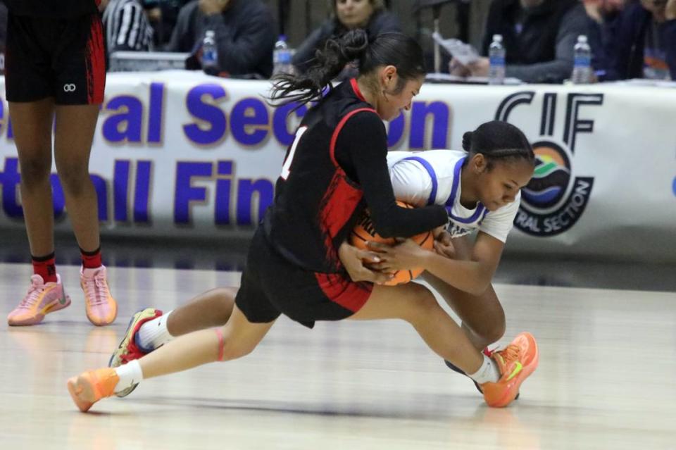 Rosamond High sophomore Abigail Cardoza reaches for a ball against Hanford West in the CIF Central Section Division V championship at Selland Arena on Feb. 24, 2024. Rosamond won, 60-45.