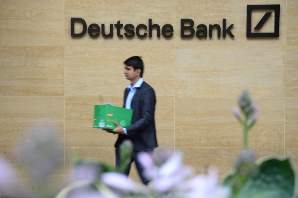 A man carries a box as he leaves a London office of Deutsche Bank which has confirmed plans to cut 18,000 positions across its global business, causing thousands of workers in the City of London to fear for their jobs. (Photo by Kirsty O'Connor/PA Images via Getty Images)