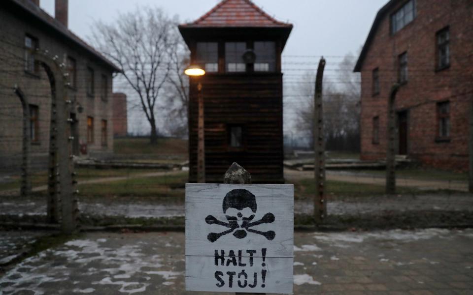 A sign reading "Stop!" in German and Polish is seen at the former Nazi German concentration and extermination camp Auschwitz - KACPER PEMPEL/REUTERS