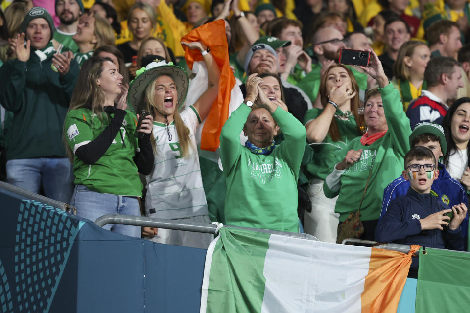 Irish fans cheer during the Women's World Cup soccer match between Australia and Ireland at Stadium Australia in Sydney, Australia, Thursday, July 20, 2023. Almost a third of Australians are foreign-born, according to the Australian Bureau of Statistics, and over half have one or more parents born outside of the country leading to vocal crowds at matches. (AP Photo/Sophie Ralph)