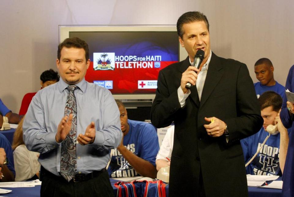 Chip Beck, left, applauds as UK coach John Calipari secures a $1,000 pledge from former coach Tubby Smith on the phone during the “Hoops For Haiti Telethon” at the WKYT-27 studios in Lexington, Jan. 17, 2010.