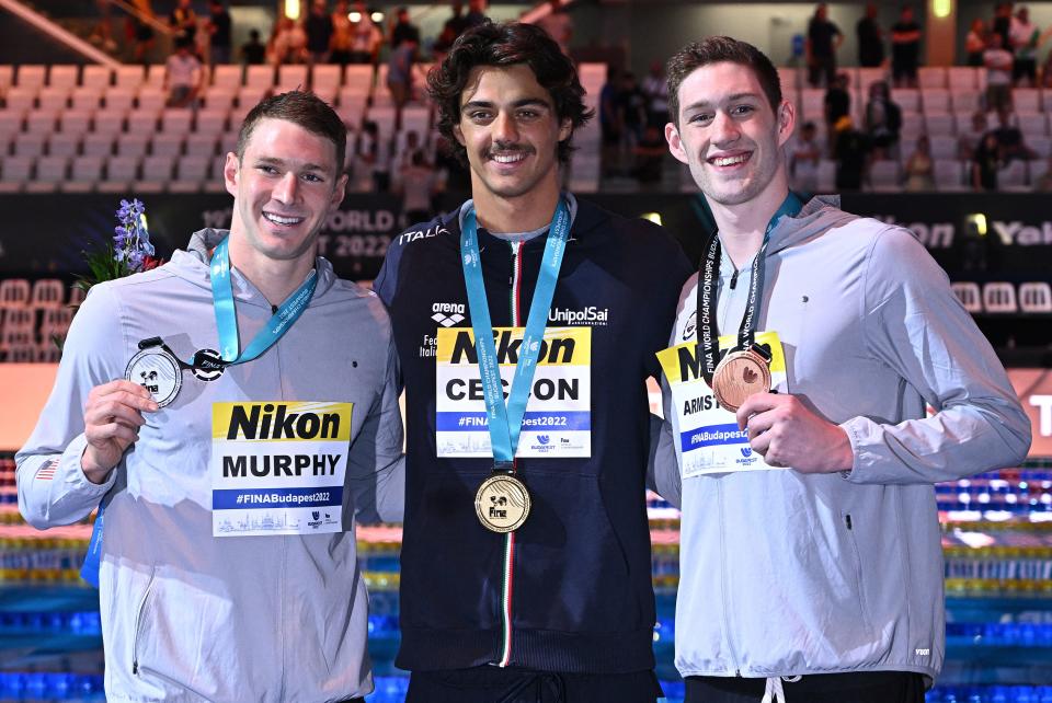 Ryan Murphy, Thomas Ceccon and Hunter Armstrong, pictured here after the men's 100m backstroke final.