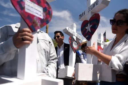 People pay their respects two days after a mass shooting in El Paso