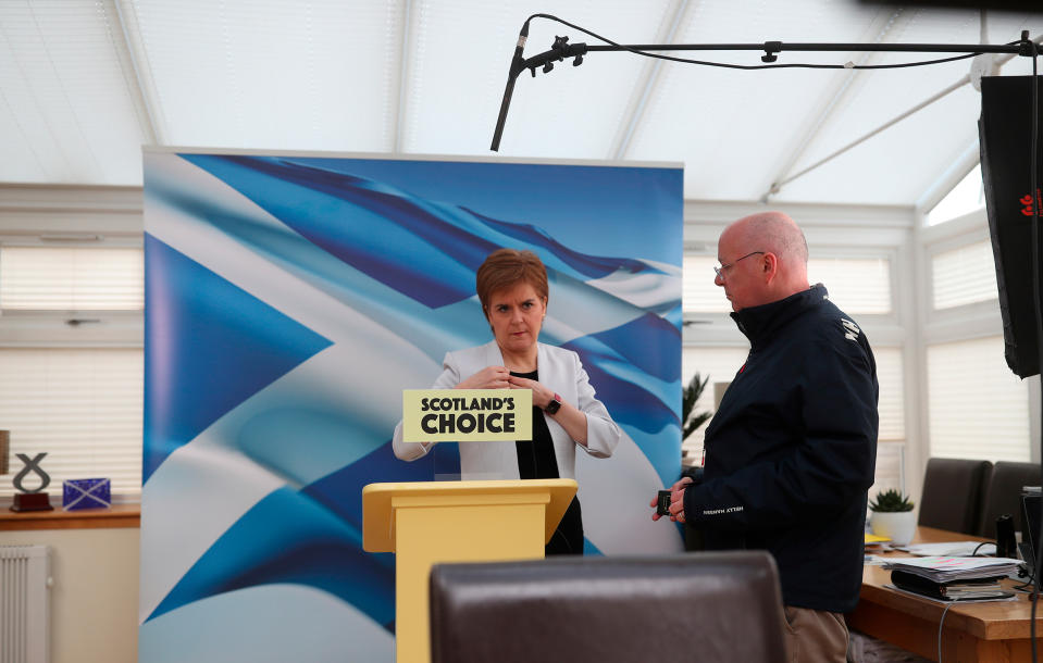 Then First Minister Nicola Sturgeon, with her husband Peter Murrell, rehearses her SNP campaign speech during the Scottish Parliamentary Elections, in Glasgow, Scotland on March 28, 2021.<span class="copyright">Russell Cheyne—PA Wire/Press Association/AP</span>