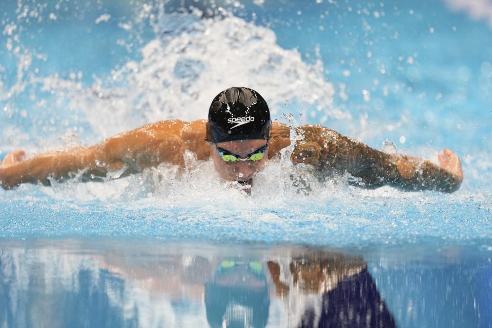 Caeleb Dressel swims during the Men's 100 butterfly finals Saturday, June 22, 2024, at the US Swimming Olympic Trials in Indianapolis. (AP Photo/Michael Conroy)