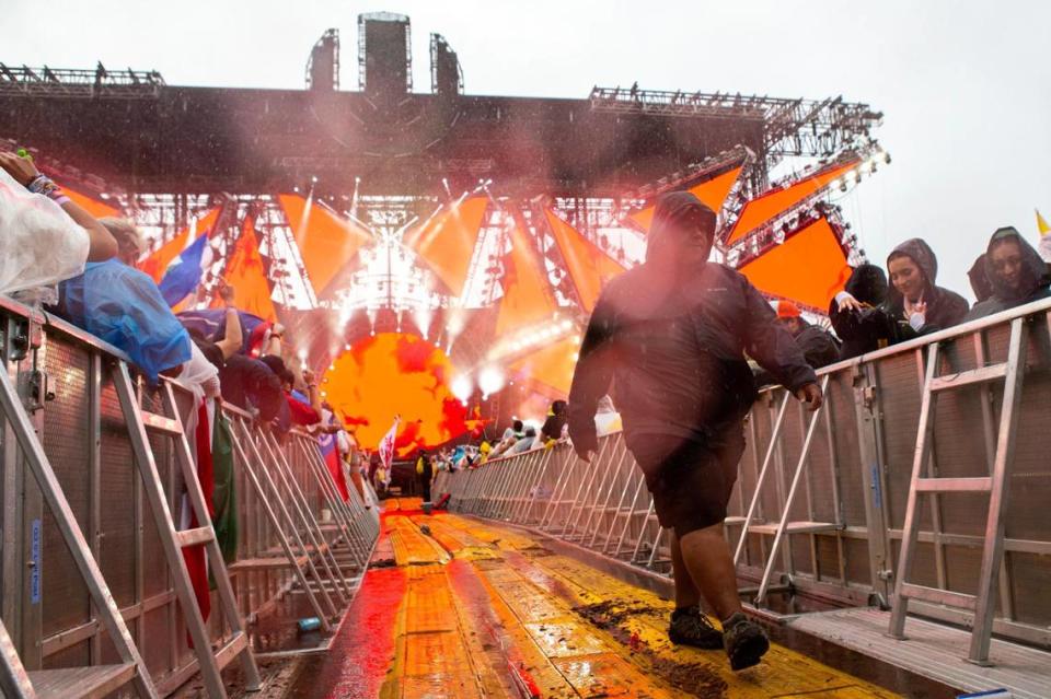 A security guard walks down the middle of the Main Stage during Ultra 2024 at Bayfront Park in Downtown Miami on Friday, March 22, 2024.