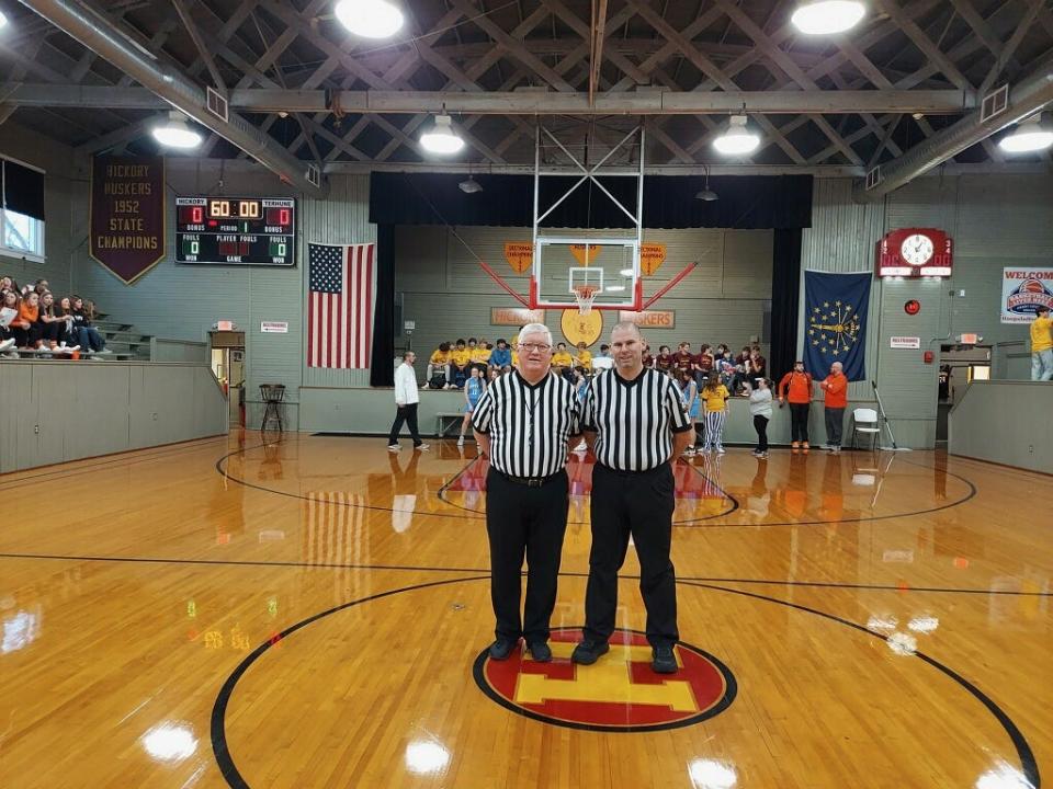 Dave Berkemeier (right) worked his final game as a basketball official with his nephew, Ryan Berkemeier