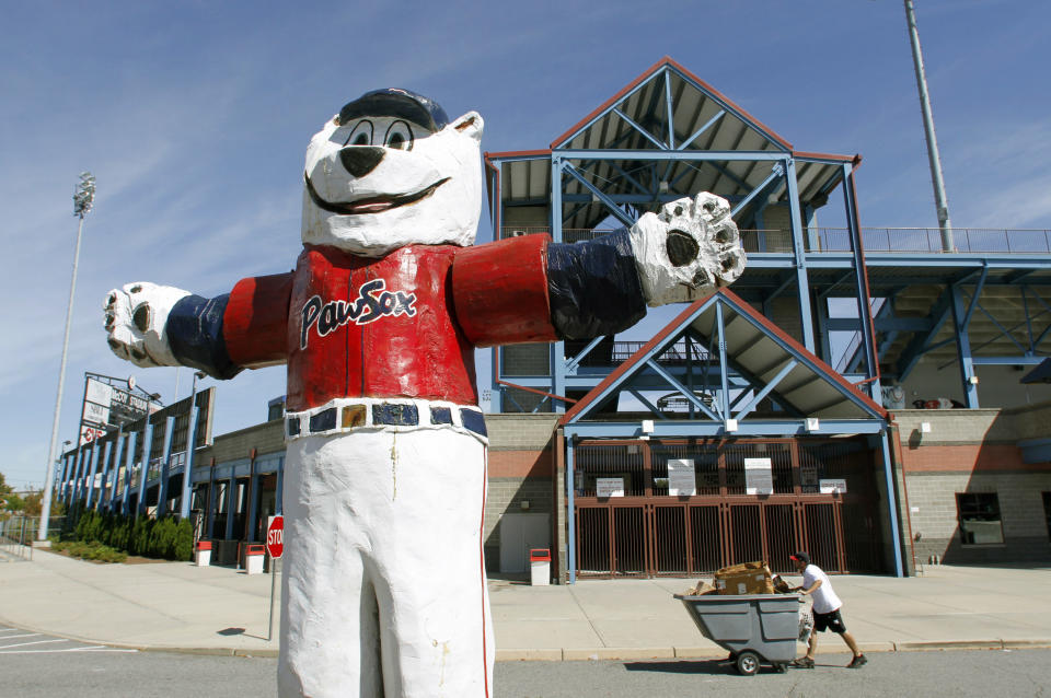 In this Sept. 23, 2010 photo, a statue of the Pawtucket Red Sox baseball team mascot "Paws" stands outside McCoy Stadium, in Pawtucket, R.I. Fans of the show, based in the fictional Rhode Island town of Quahog, can hit the road on a bus tour highlighting a dozen sites in the state that have served as inspiration. (AP Photo/Steven Senne)