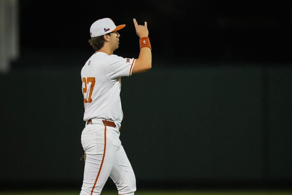 Texas infielder Jack O'Dowd (27) holds up horns as the Longhorns play San Diego at UFCU Disch–Falk Field on Friday, Feb. 16, 2024.