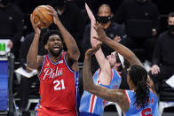 Philadelphia 76ers' Joel Embiid (21) shoots over Brooklyn Nets' Joe Harris (12) during the first half of an NBA basketball game Thursday, Jan. 7, 2021, in New York. (AP Photo/Frank Franklin II)