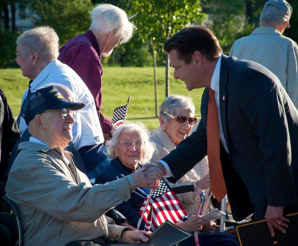 Symmes Township Trustee President Phil Beck greets veterans during a past Memorial Day program.