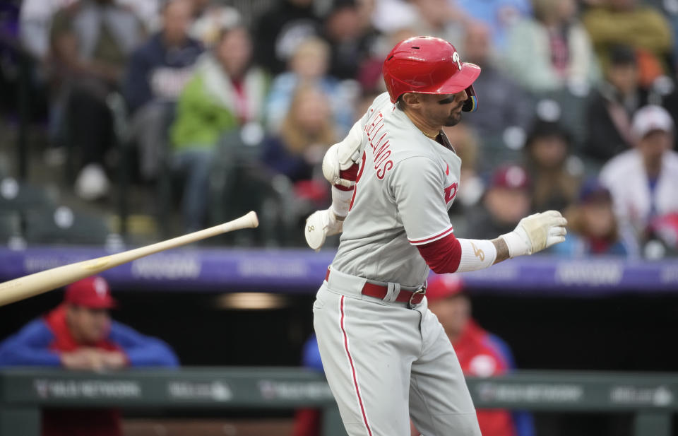 Philadelphia Phillies' Nick Castellanos watches his RBI single off Colorado Rockies starting pitcher Ryan Feltner during the first inning of a baseball game Saturday, May 13, 2023, in Denver. (AP Photo/David Zalubowski)