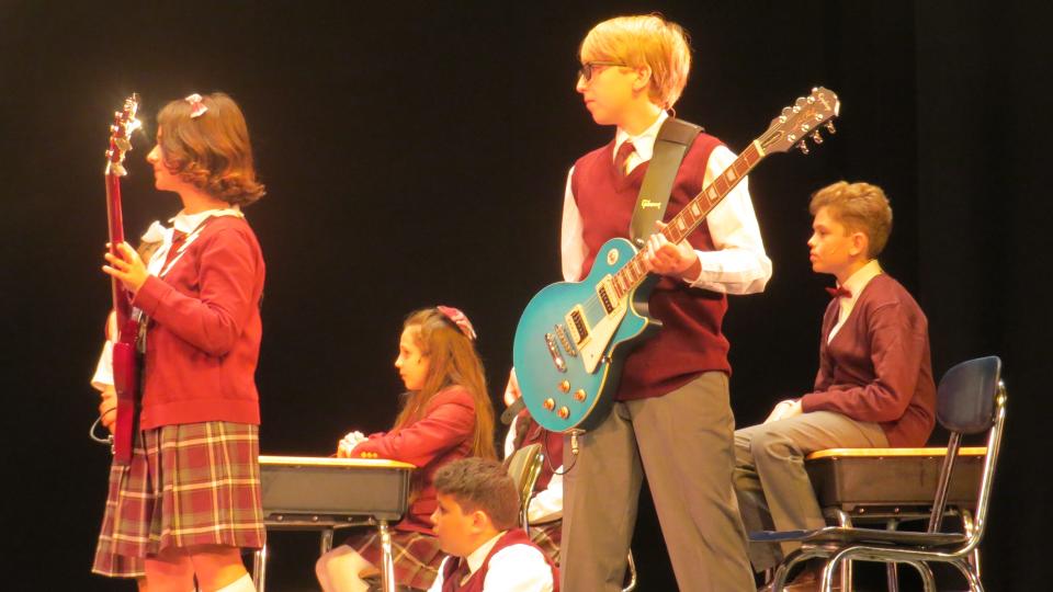 The student cast of the Mayo Performing Arts Center Performing Arts School in dress rehearsal for their spring musical "School of Rock."