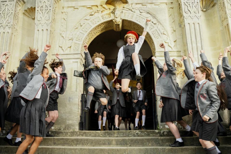 A group of young children dance