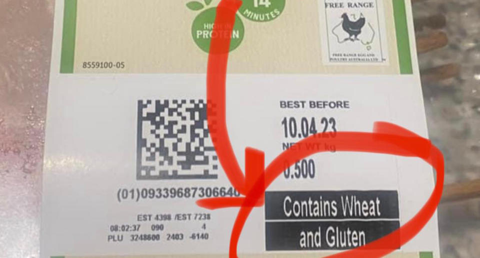 A photo of the packaging after it was changed, which shows a warning on the front for wheat and gluten in large writing.