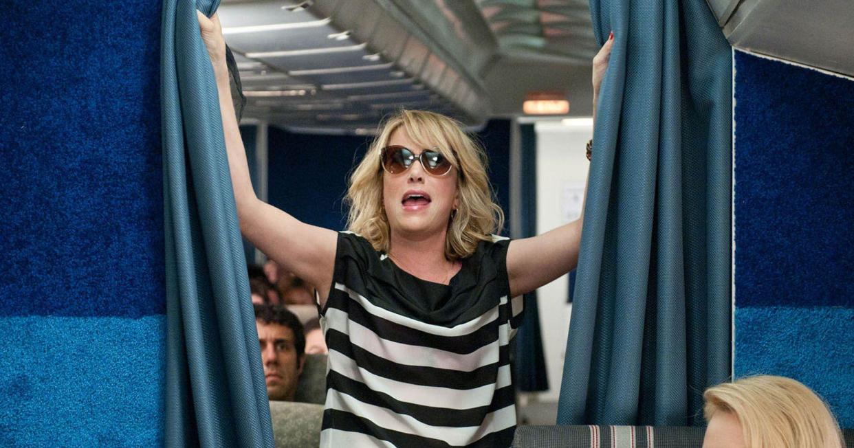 Airports may face a crackdown on selling booze to avoid passengers getting as drunk as Kristen Wiig in Bridesmaids: Universal Pictures