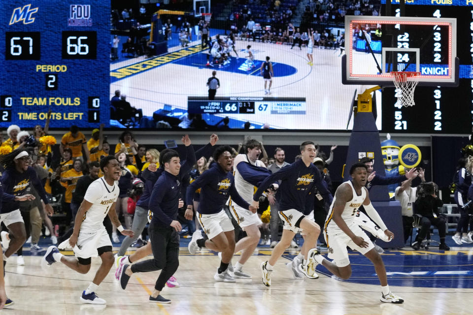 Merrimack celebrates after defeating Fairleigh Dickinson 67-66 at the buzzer during the Northeast Conference men's NCAA college basketball championship game, Tuesday, March 7, 2023, in North Andover, Mass. (AP Photo/Charles Krupa)