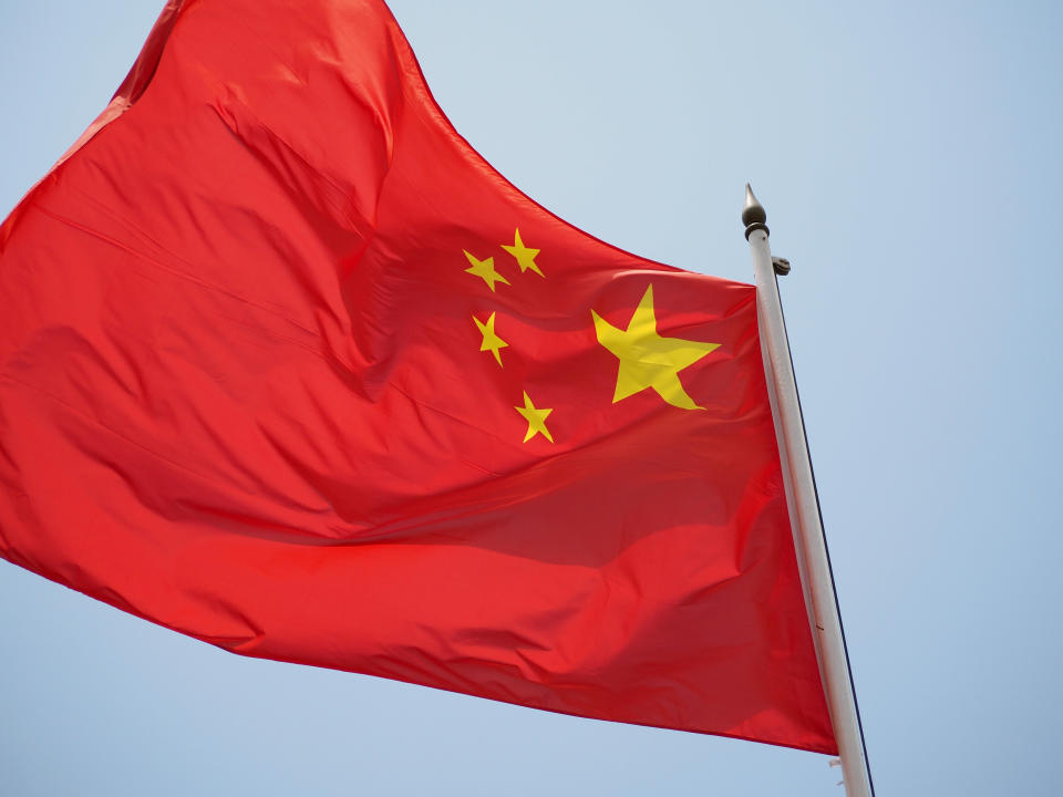 LIMA, PERU - 2020/02/17: Chinese flag waving over blue sky at the People's Republic of China embassy in Lima, Peru. (Photo by Carlos Garcia Granthon/Fotoholica Press/LightRocket via Getty Images)