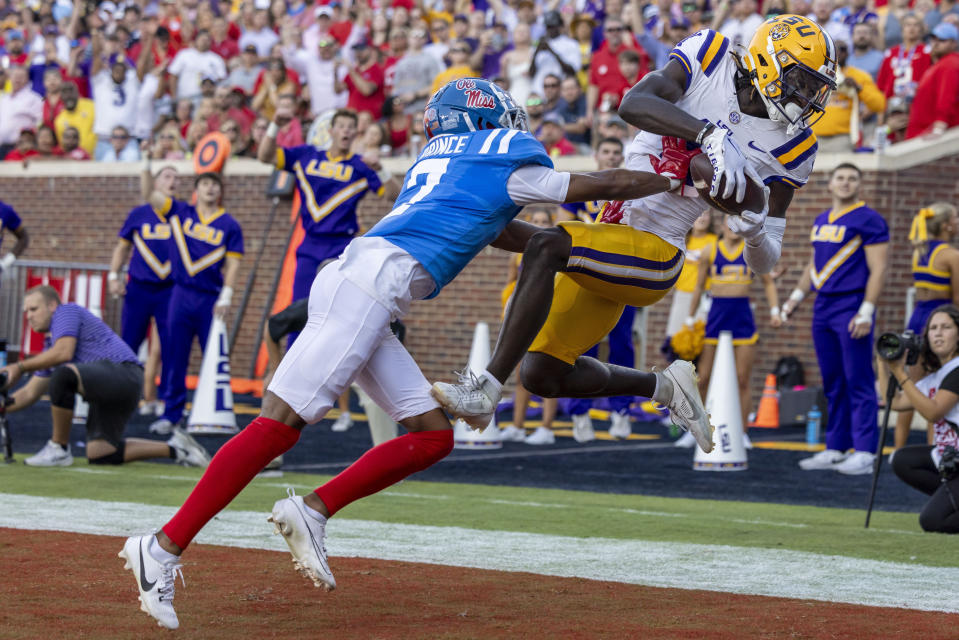 LSU wide receiver Brian Thomas Jr. grabs a touchdown pass over Mississippi defensive back Deantre Prince during the first half of an NCAA football game on Saturday, Sept. 30, 2023, in Oxford, Miss. (AP Photo/Vasha Hunt)