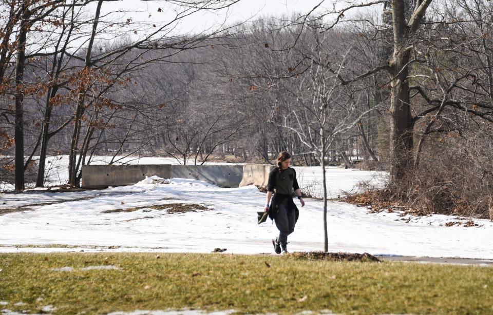 Nicole Martin of Lansing walks in Fulton Park, Monday, Feb. 21, 2022. Martin says there's about eight miles of trails that are generally well kept.