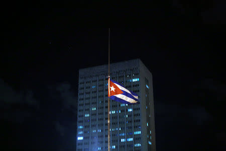 A Cuban flag flies at half mast near the Malecon, following the announcement of the death of Cuban revolutionary leader Fidel Castro, in Havana, Cuba November 27, 2016. REUTERS/Carlos Barria
