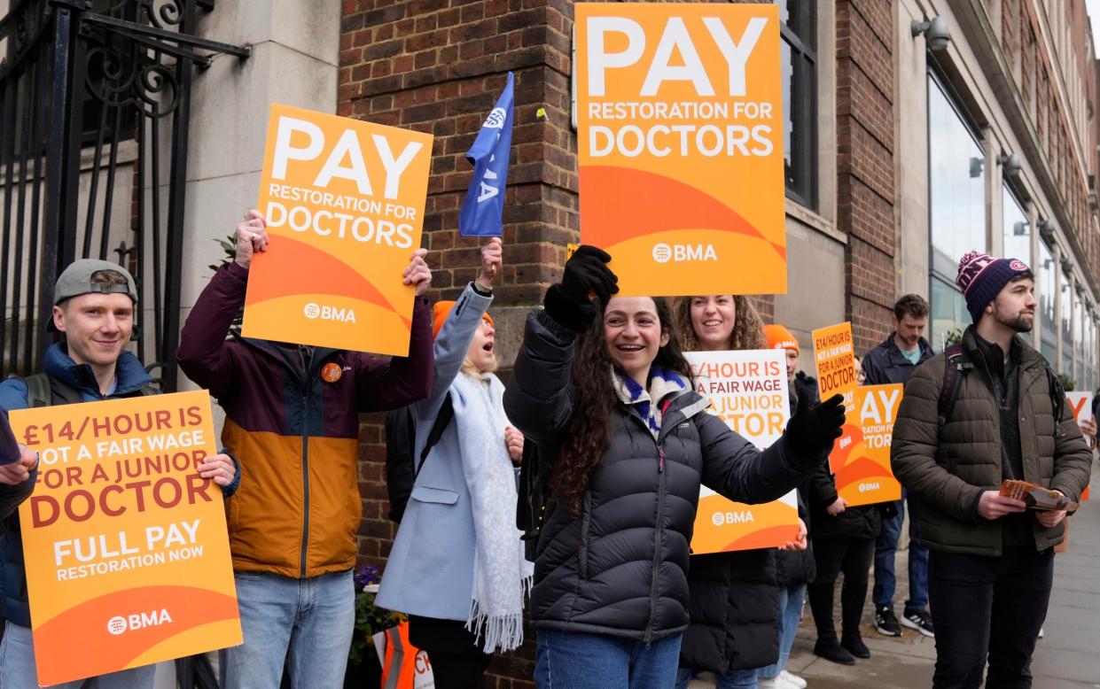 Junior doctors on a picket line outside St Mary’s Hospital, London, earlier this month - Alastair Grant/AP