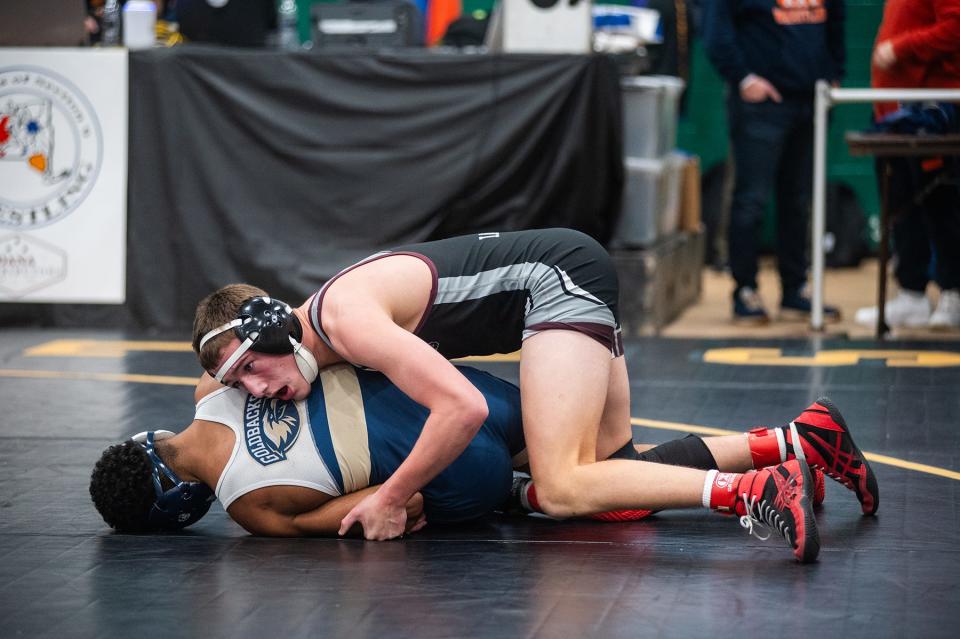 Scarsdale's Tommy Iasiello, top, wrestles Newburg's Ivan Duran in the 138 pound weight class during Eastern States Classic wrestling at SUNY Sullivan in Loch Sheldrake, NY on Friday, January 12, 2024. KELLY MARSH/FOR THE JOURNAL NEWS