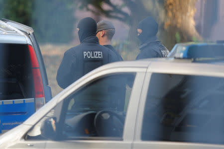 Men suspected of forming a far-right militant organisation in Chemnitz, are escorted by special police in front of the General Prosecutor's Office at the German Federal Supreme Court (Bundesgerichtshof) in Karlsruhe, Germany October 1, 2018. REUTERS/Vincent Kessler