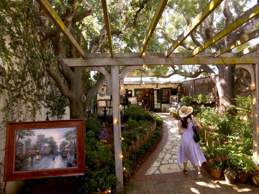  A visitor walks through the central courtyard of Der Ling Lane.