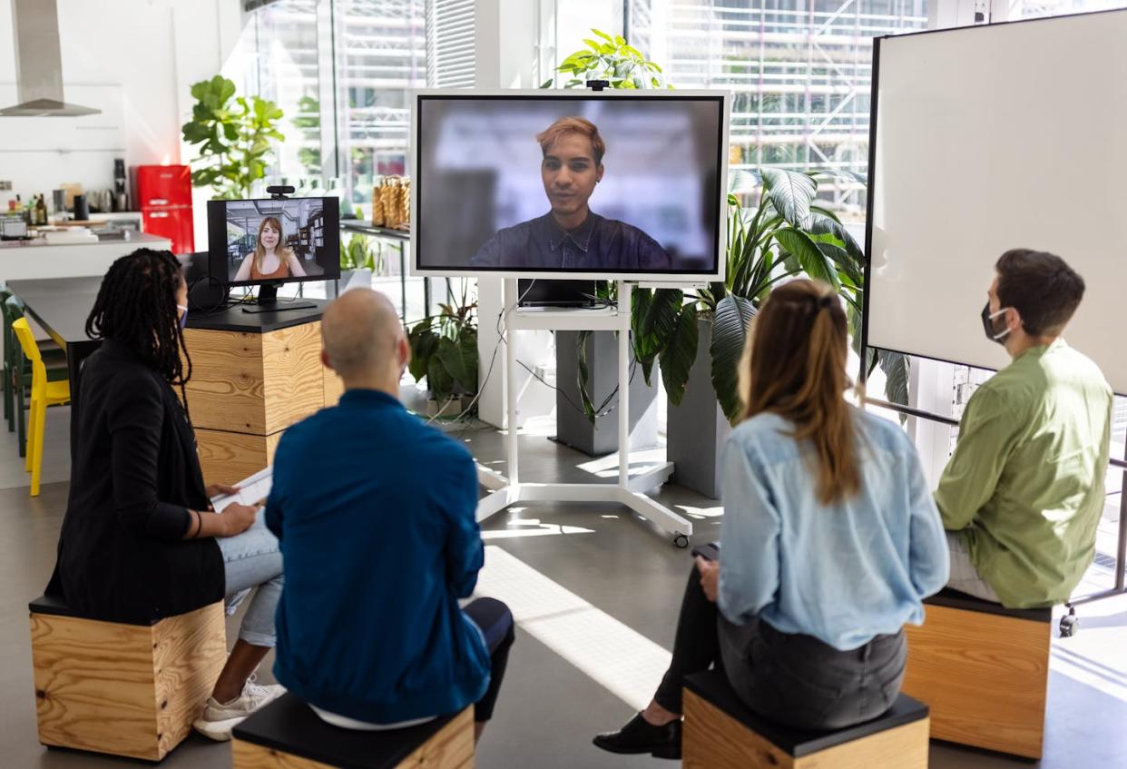 With a greater reliance on remote workers, how can people forge good relationships at work? <a href="https://www.gettyimages.com/detail/photo/start-up-business-group-having-video-conference-royalty-free-image/1327494299?phrase=work%20relationships&adppopup=true" rel="nofollow noopener" target="_blank" data-ylk="slk:Luis Alvarez/DigitalVision via Getty Images;elm:context_link;itc:0;sec:content-canvas" class="link ">Luis Alvarez/DigitalVision via Getty Images</a>