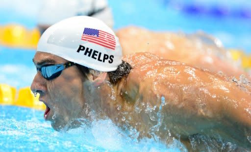 US swimmer Michael Phelps competes in the men's 200m butterfly heats swimming event at the London 2012 Olympic Games at the Olympic Park in London on July 30