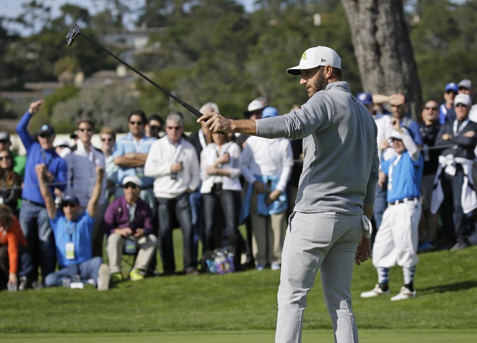 Dustin Johnson reacts after making a birdie putt on the 16th green of the Pebble Beach Golf Links during the final round of the AT&T Pebble Beach National Pro-Am golf tournament Sunday, Feb. 12, 2017, in Pebble Beach, Calif. Johnson finished in third place at total 14-under-par. (AP Photo/Eric Risberg)